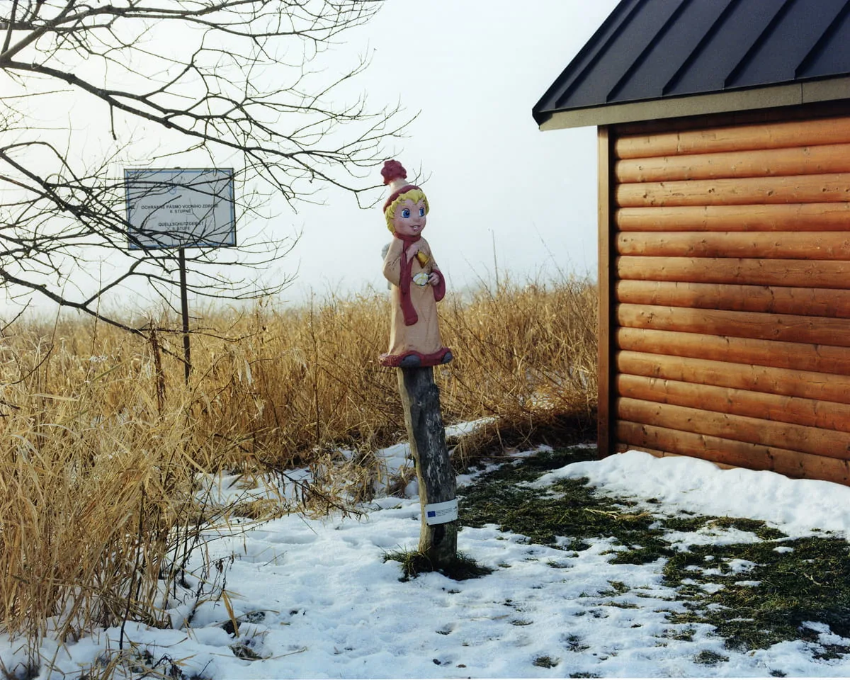 Fotografie Pfosten mit Figur
